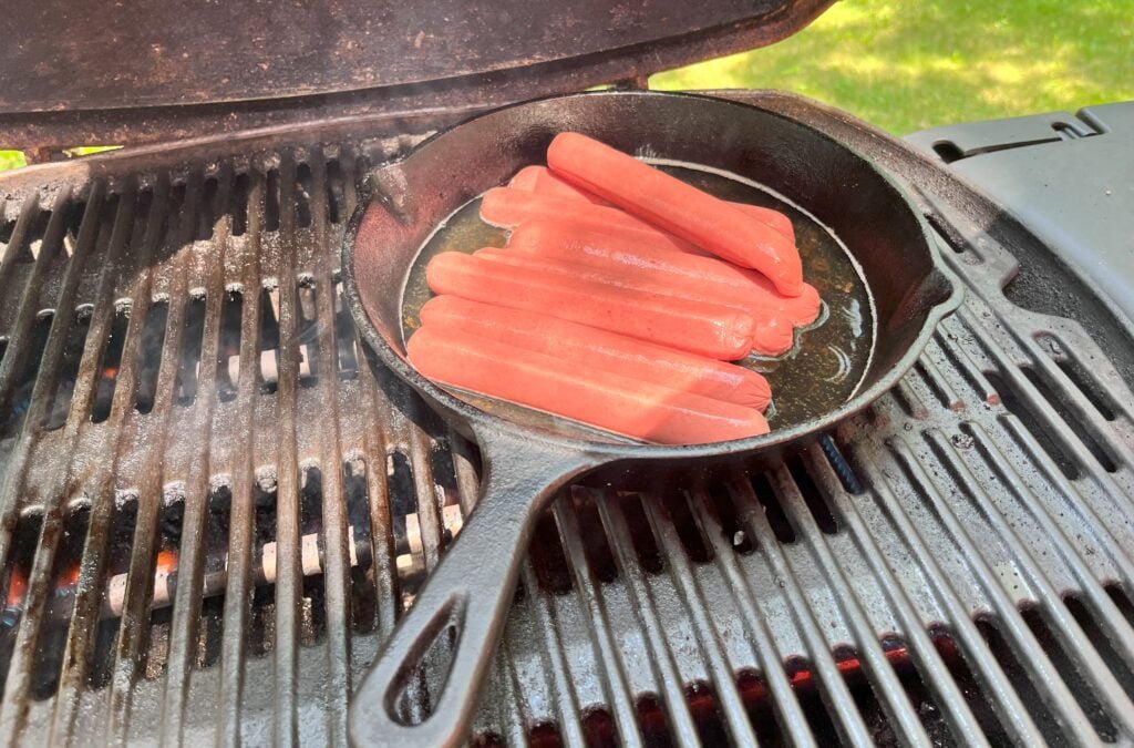 Grilling hotdogs with cast iron skillet