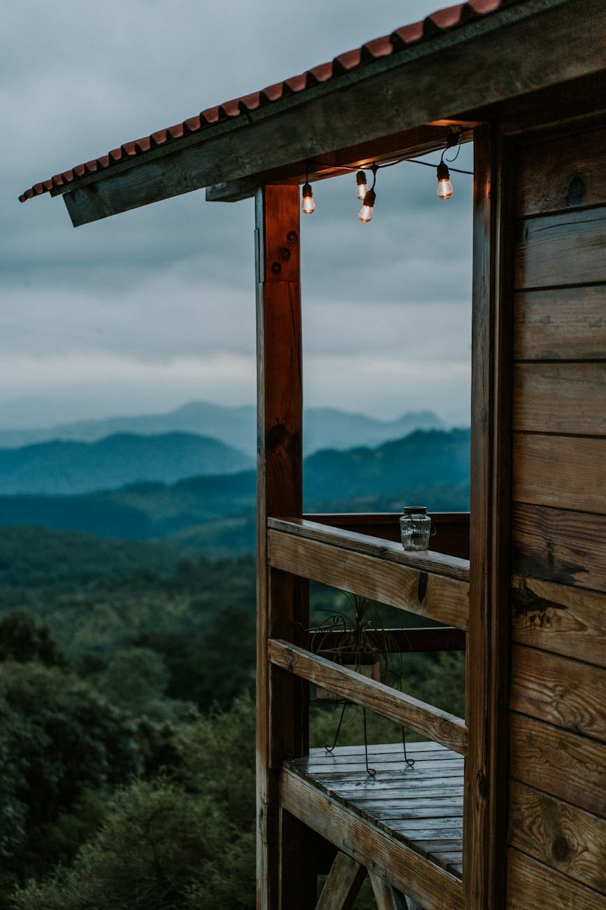 Wooden porch with view on landscape - off the grib in your cabin