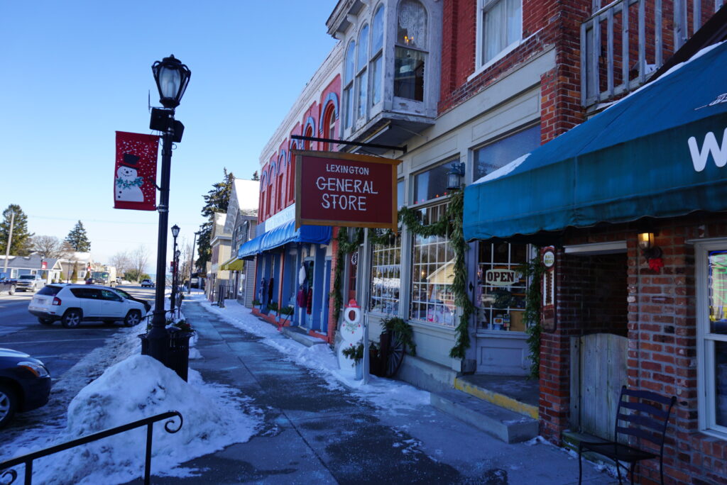 Snowy street with general store