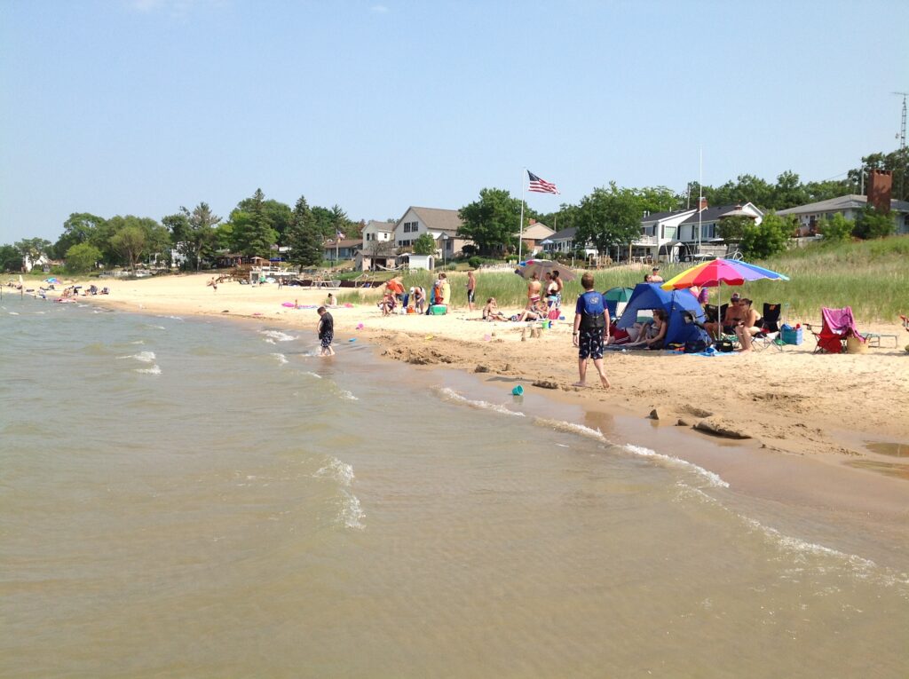 Crowded beach with colorful umbrellas